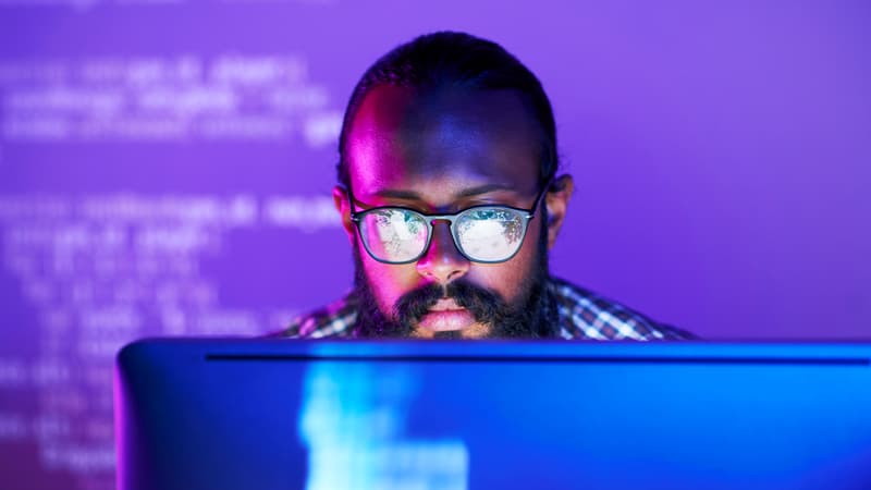 Software Developer Coding With Neon Lighting