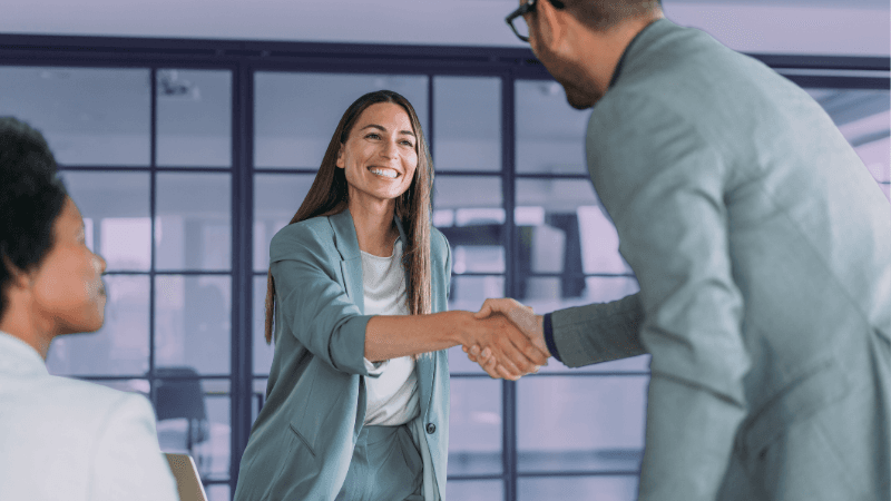 Professionals Shaking Hands in Job Interview
