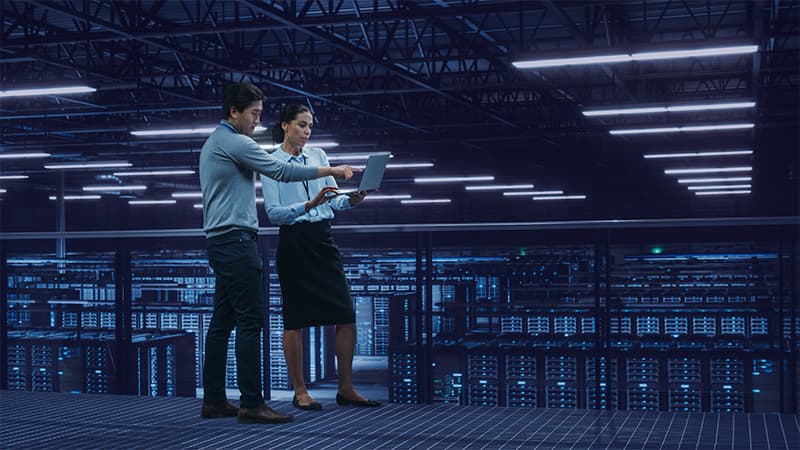 Data Center Female System Administrator And Male IT Specialists