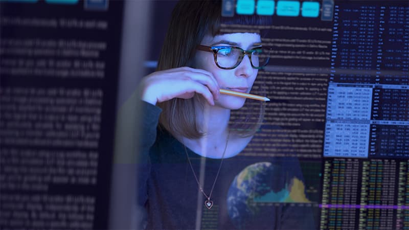 Case Study - Delivering High Calibre Talent in 48 Hours -Woman Studying A See Through Computer Screen & Contemplating
